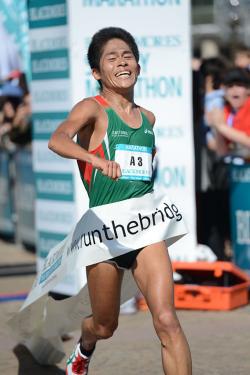 In this handout photo provided by the Sydney Running Festival, Yuki Kawauchi of Japan crosses the line to win in record time in the marathon during the Sydney Running Festival on September 16, 2012 in Sydney, Australia.,71388746