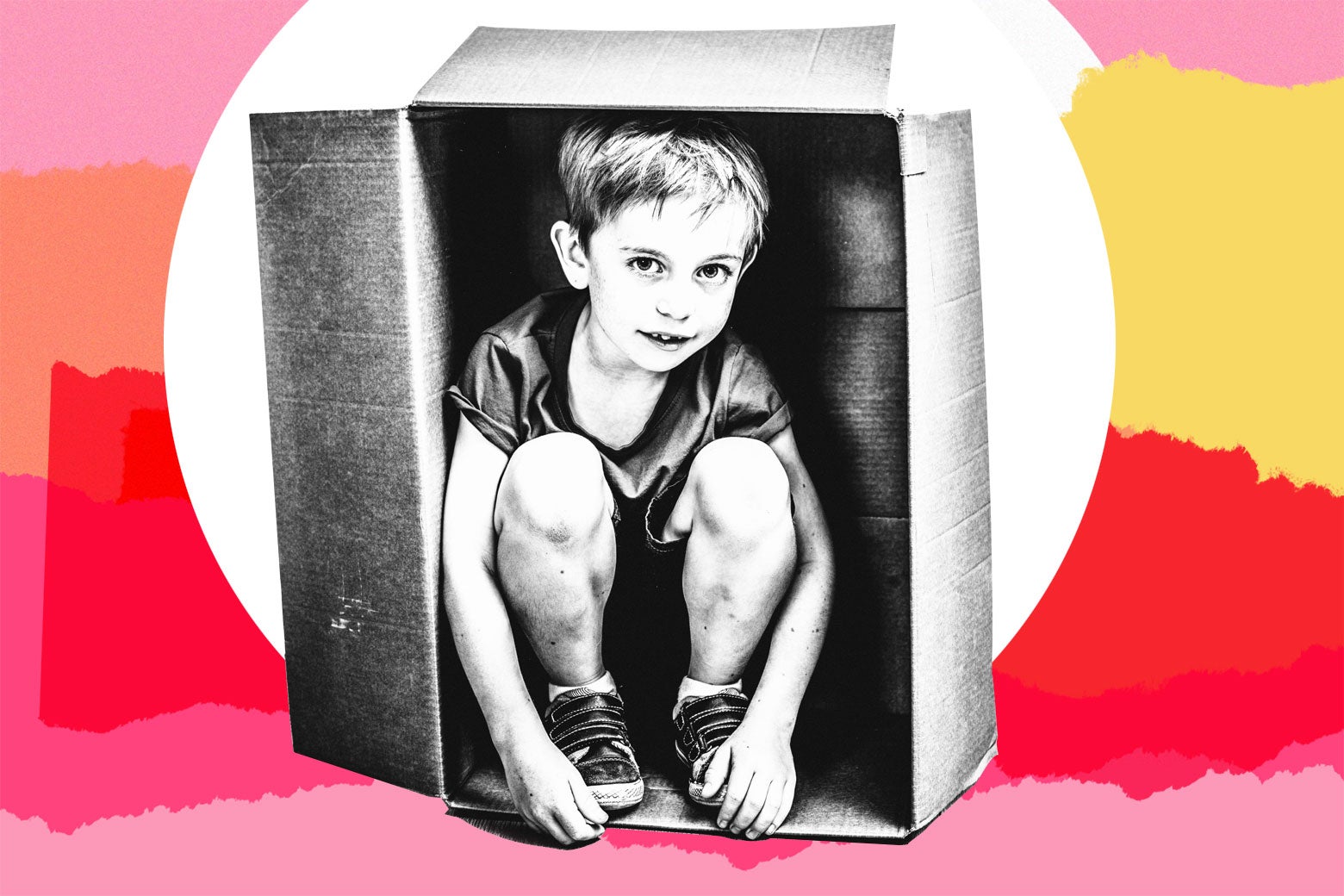Boy sitting in a moving box.