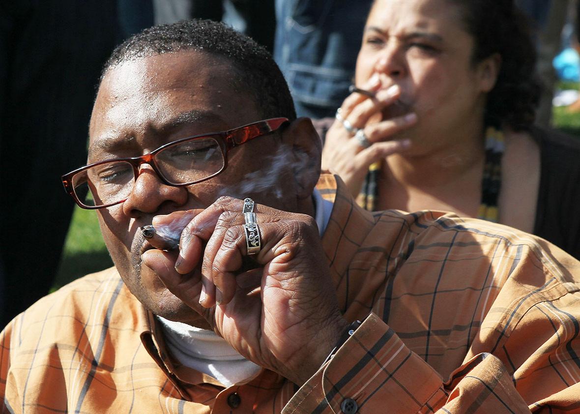 A marijuana user named Bob smokes marijuana during a 420 Day celebration on "Hippie Hill" in Golden Gate Park April 20, 2010 in San Francisco, California.  