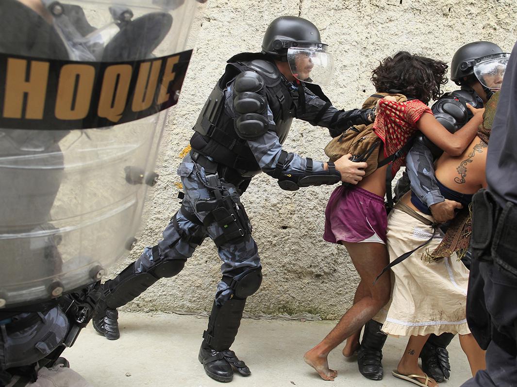 Police officers clash with supporters of the native Indian community in Brazil during a protest outside the Indian museum, next to the Maracana stadium, in Rio de Janeiro, on Dec. 16, 2013