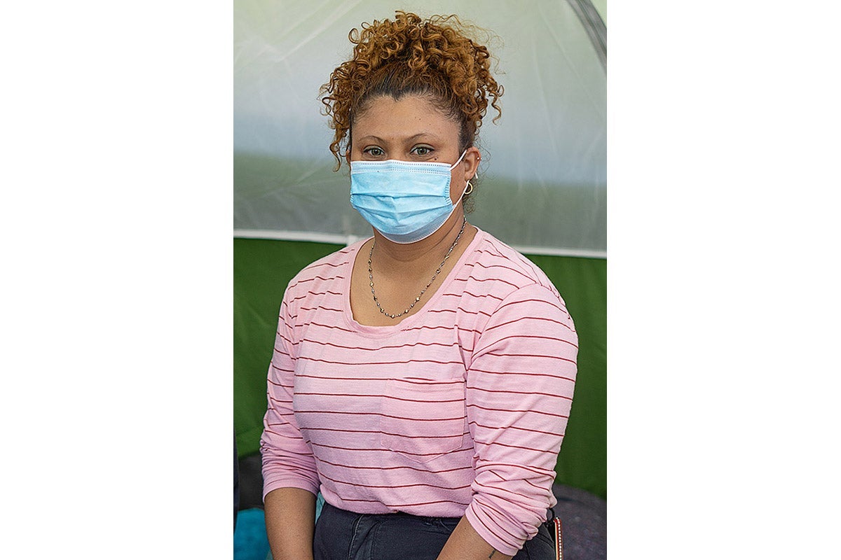 A woman in a face mask.