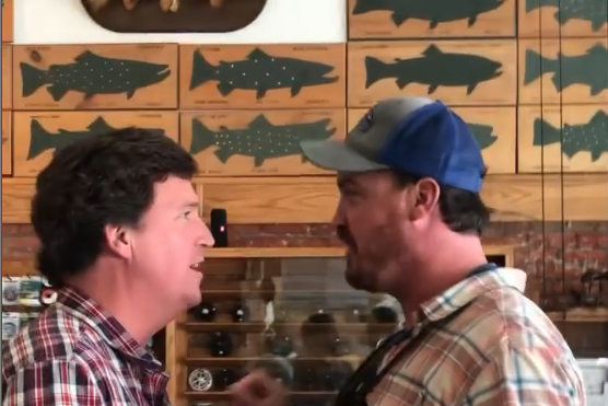 Dan Bailey confronts Tucker Carlson at a fishing store.