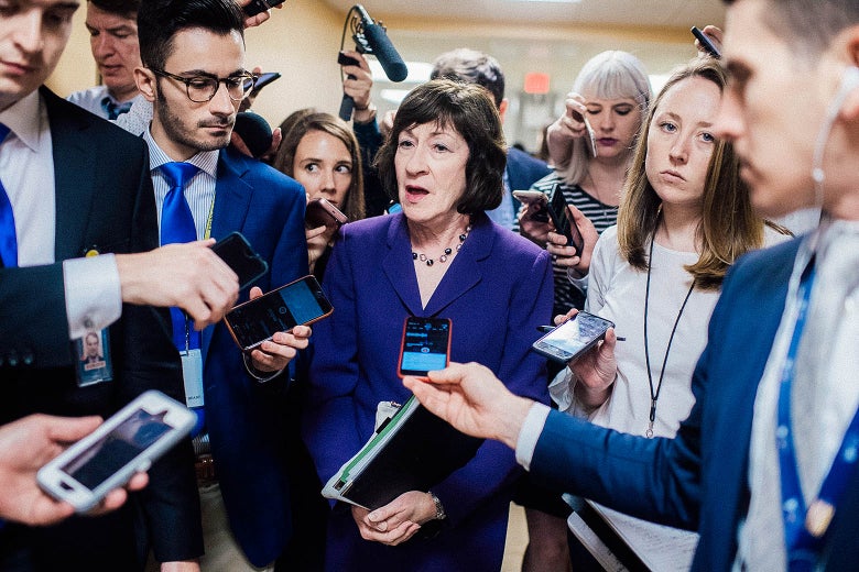 Sen. Susan Collins talks with reporters in the Capitol’s Senate subway.