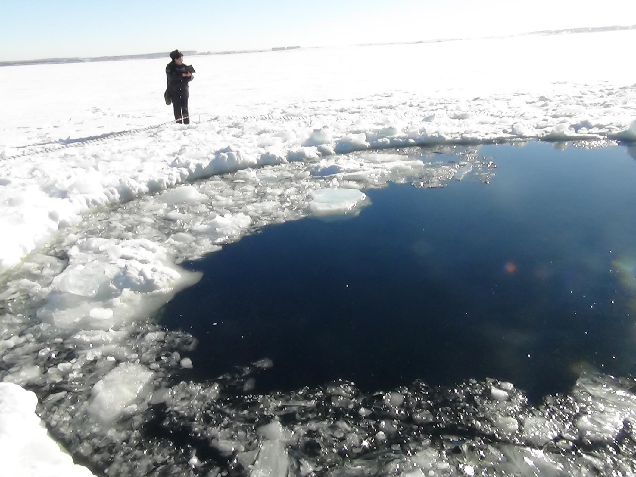 A hole in the Chebarkul Lake made by meteorite fragments. A meteorite hit Russia's Chelyabinsk region on February 15, 2013.
