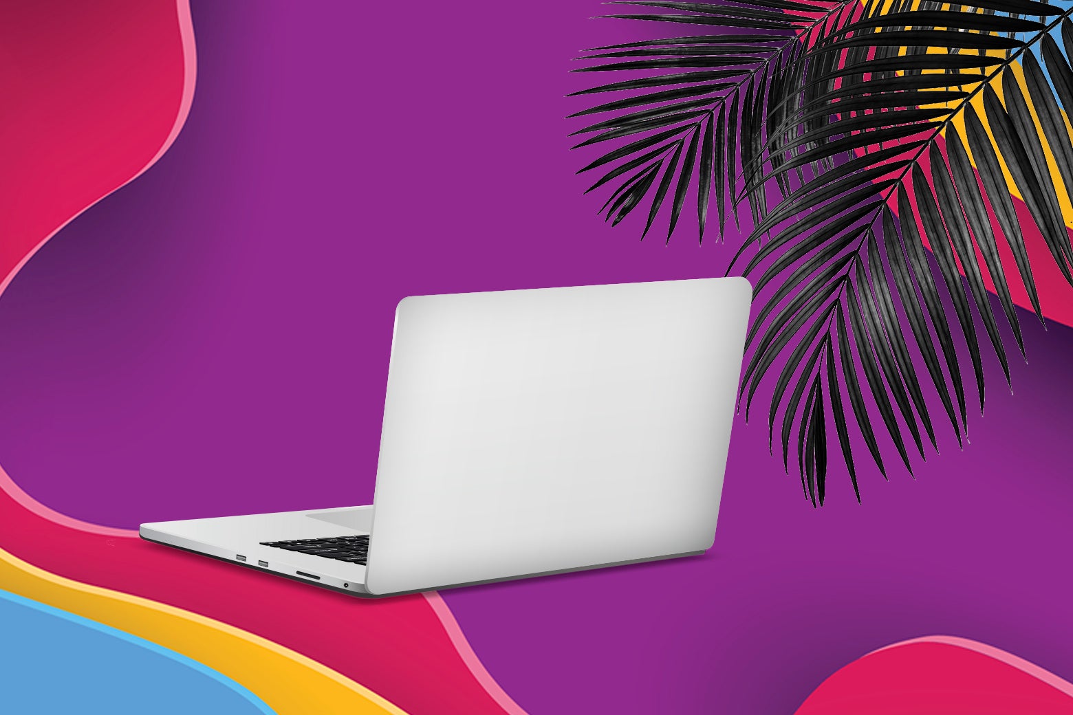 An open laptop, with some tropical greenery in the background.