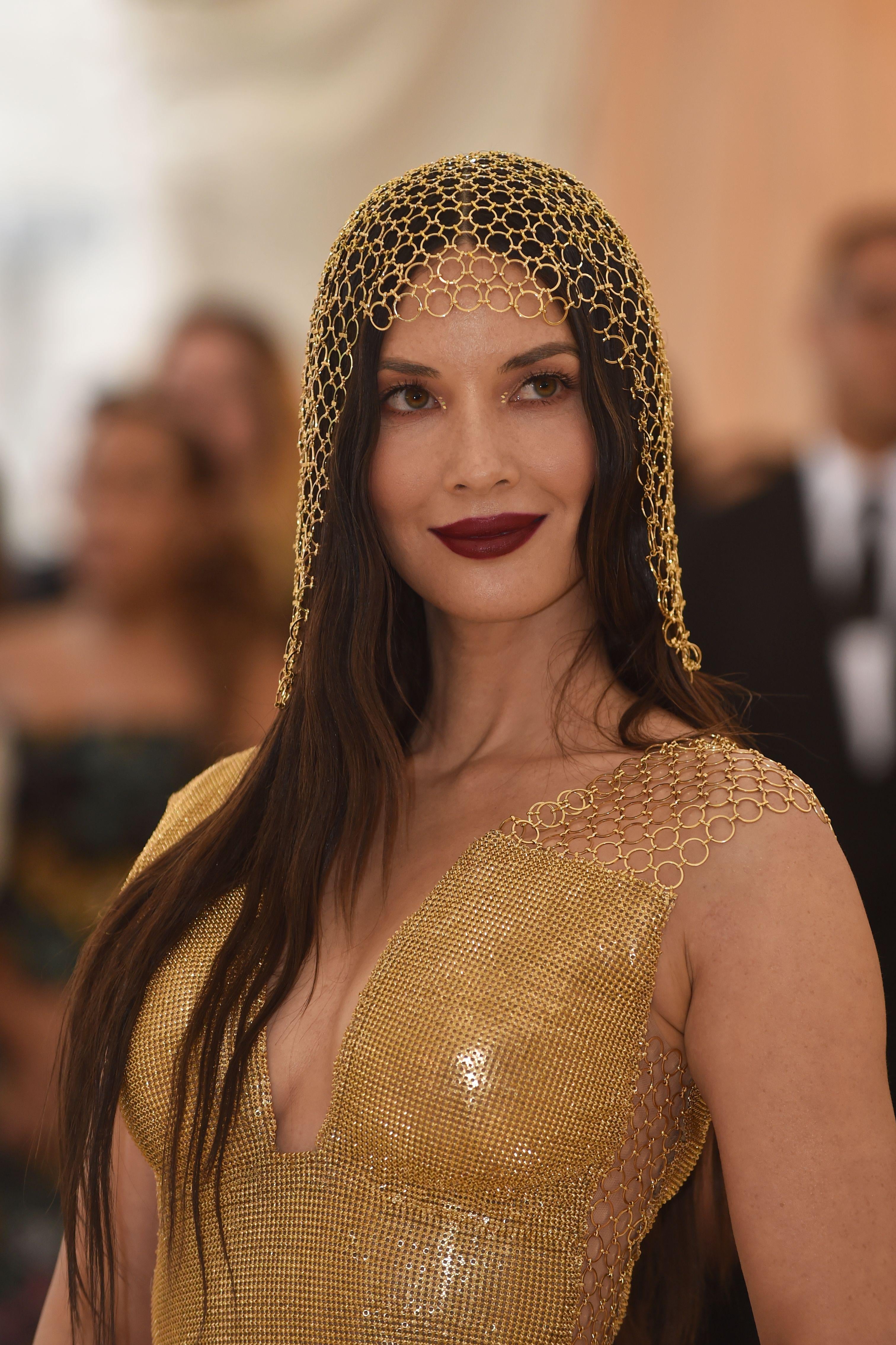 Actress Olivia Munn arrives for the 2018 Met Gala on May 7, 2018, at the Metropolitan Museum of Art in New York. - The Gala raises money for the Metropolitan Museum of Arts Costume Institute. The Gala's 2018 theme is Heavenly Bodies: Fashion and the Catholic Imagination. (Photo by Hector RETAMAL / AFP) (Photo credit should read HECTOR RETAMAL/AFP/Getty Images)