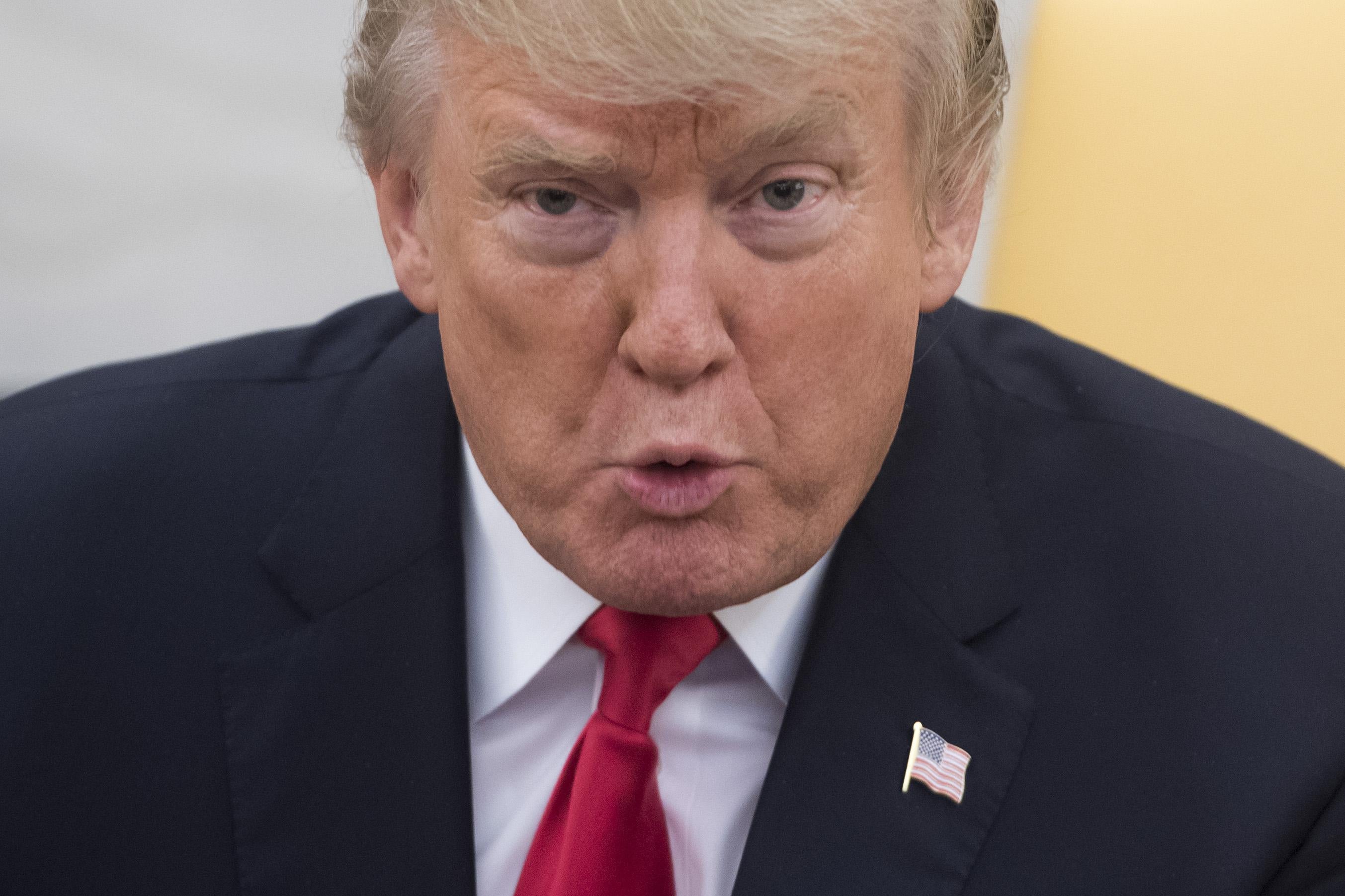 US President Donald Trump speaks about tax reform during a meeting with families to discuss how the tax reform plan would affect them in the Oval Office of the White House in Washington, DC, December 5, 2017. / AFP PHOTO / SAUL LOEB        (Photo credit should read SAUL LOEB/AFP/Getty Images)