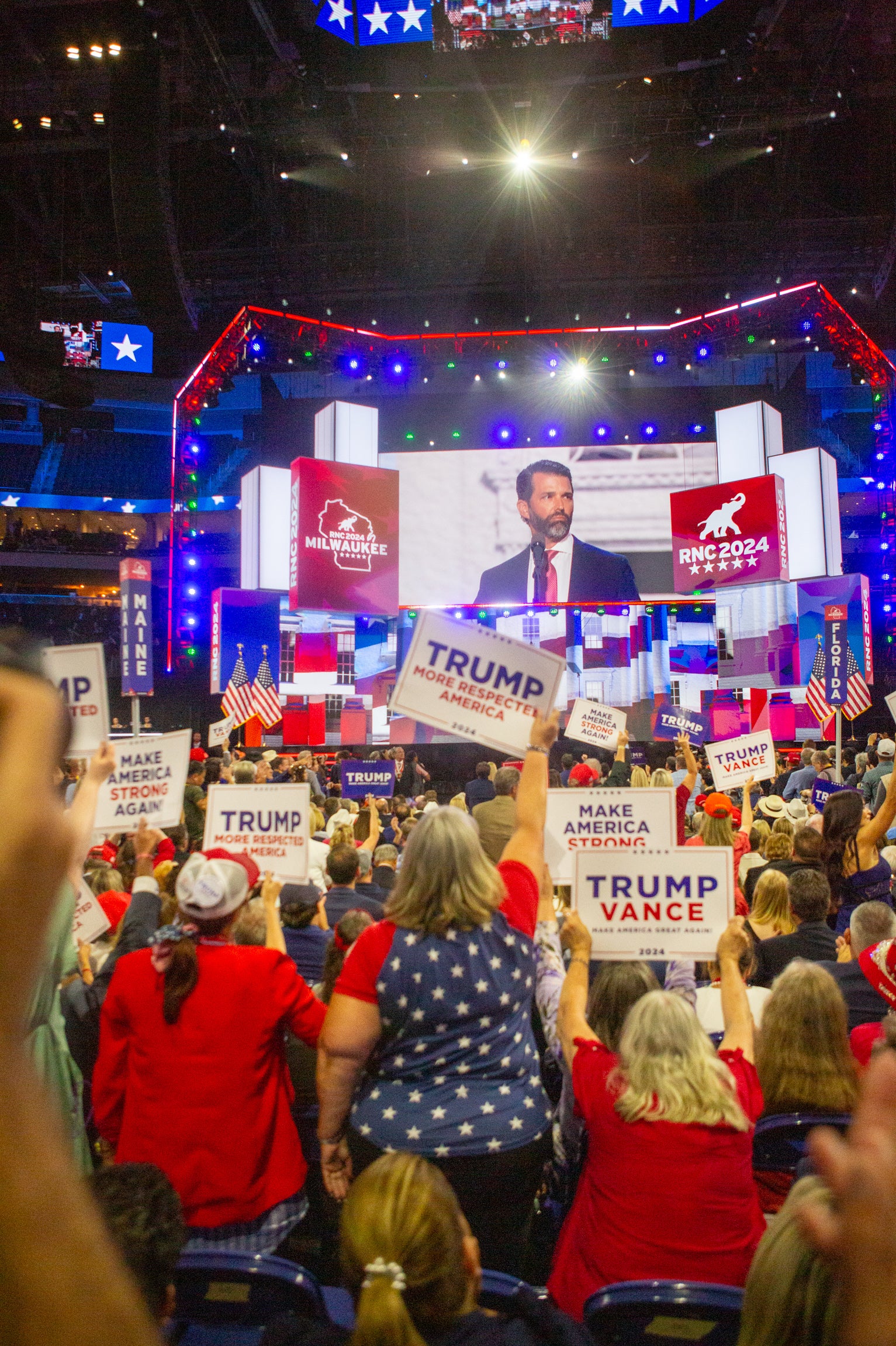 Donald Trump Jr. looks over to his father as he delivers an impassioned speech that featured his eldest daughter, Kai Trump.