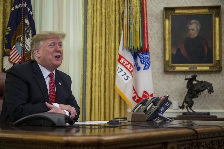 President Donald Trump makes a video call to service members from the Army, Marine Corps, Navy, Air Force, and Coast Guard stationed worldwide in the Oval Office at the White House on December 25, 2018.