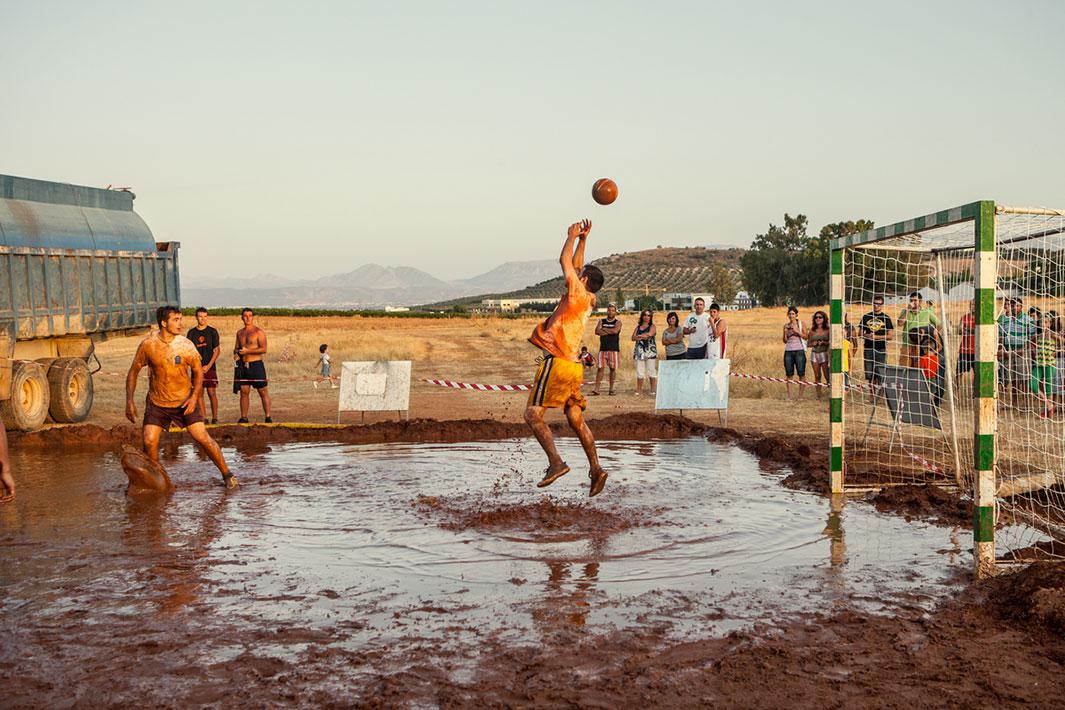 MOLLINA, SPAIN - AUGUST 12 2009: Young men play mud-football. The budget for patronal festivities has been cut so much that only very cheap activities were possible. Photo by Carlos Spottorno / Getty Images