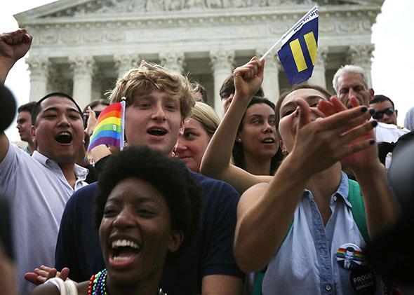 Same-sex marriage supporters rejoice after the U.S Supreme Court hands down a ruling regarding same-sex marriage June 26, 2015 outside the Supreme Court in Washington, DC. 