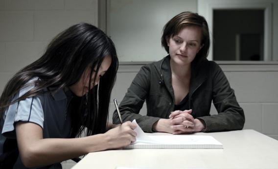 (L) Michelle Ang as Kimmie and (C) Elisabeth Moss as Robin Griffin.