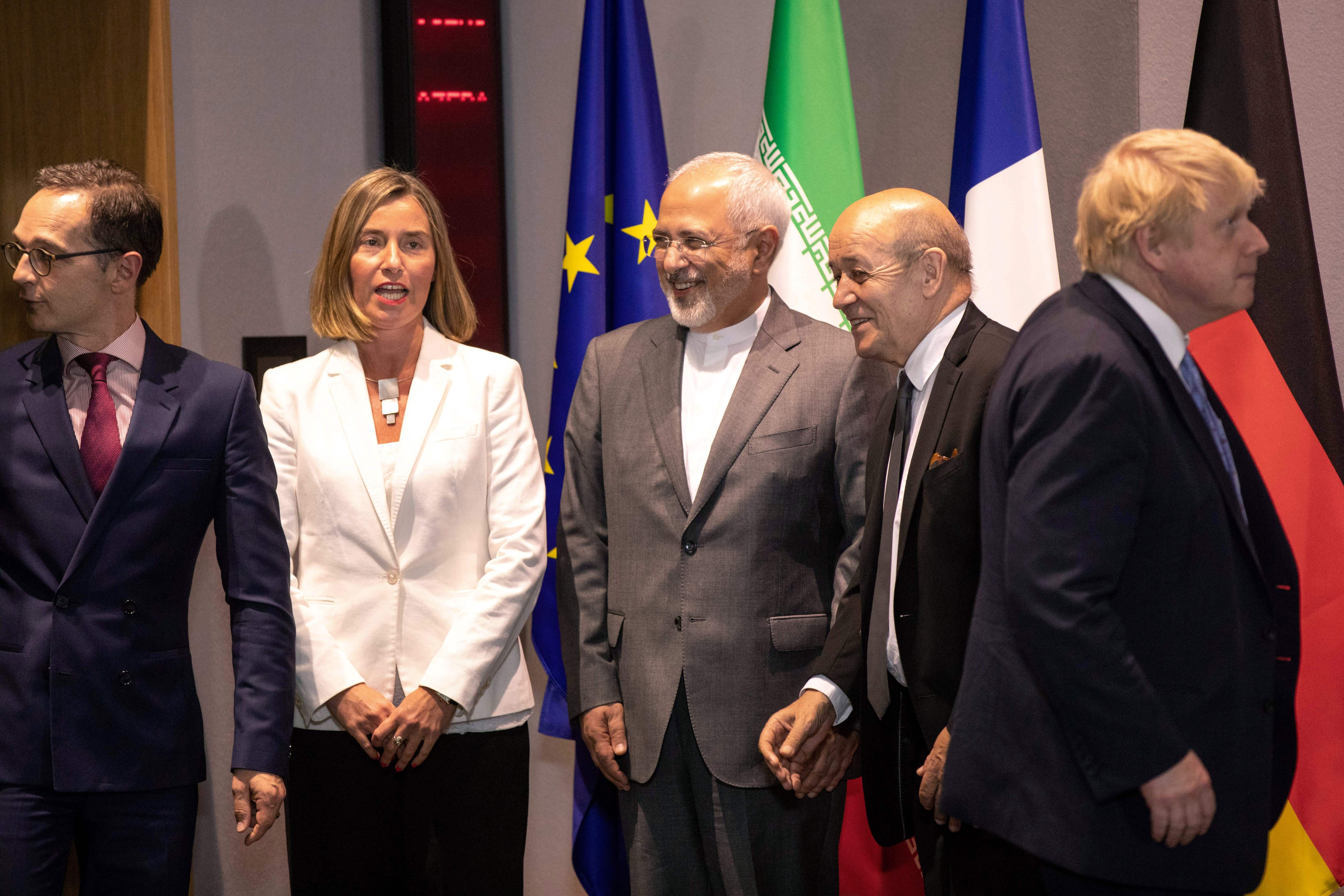 Iran's Foreign Minister Mohammad Javad Zarif (C), Britain's Foreign Secretary Boris Johnson (R), France's Foreign Minister Jean-Yves Le Drian (2nd R), Germany Foreign Minister Heiko Maas (L) -- the ministers of the three European signatories to the 2015 nuclear deal - and EU High Representative for Foreign Affairs Federica Mogherini (2nd L) pose before a meeting of EU/E3 with Iran at the EU headquarters in Brussels on May 15, 2018. - Iran's foreign minister said on May 15 that efforts to save the nuclear deal after the abrupt US withdrawal were 'on the right track' as he began talks with European powers in Brussels. (Photo by Olivier Matthys / POOL / AFP)        (Photo credit should read OLIVIER MATTHYS/AFP/Getty Images)