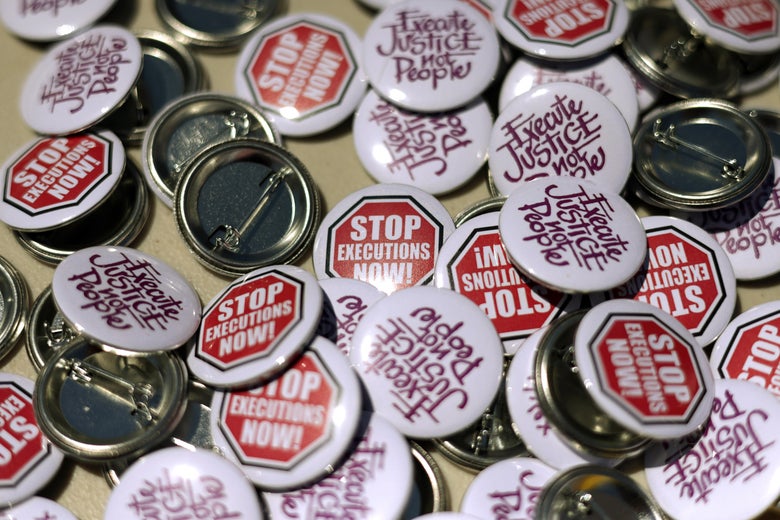 Buttons with anti–death penalty slogans are seen during a vigil against the death penalty in front of the U.S. Supreme Court.