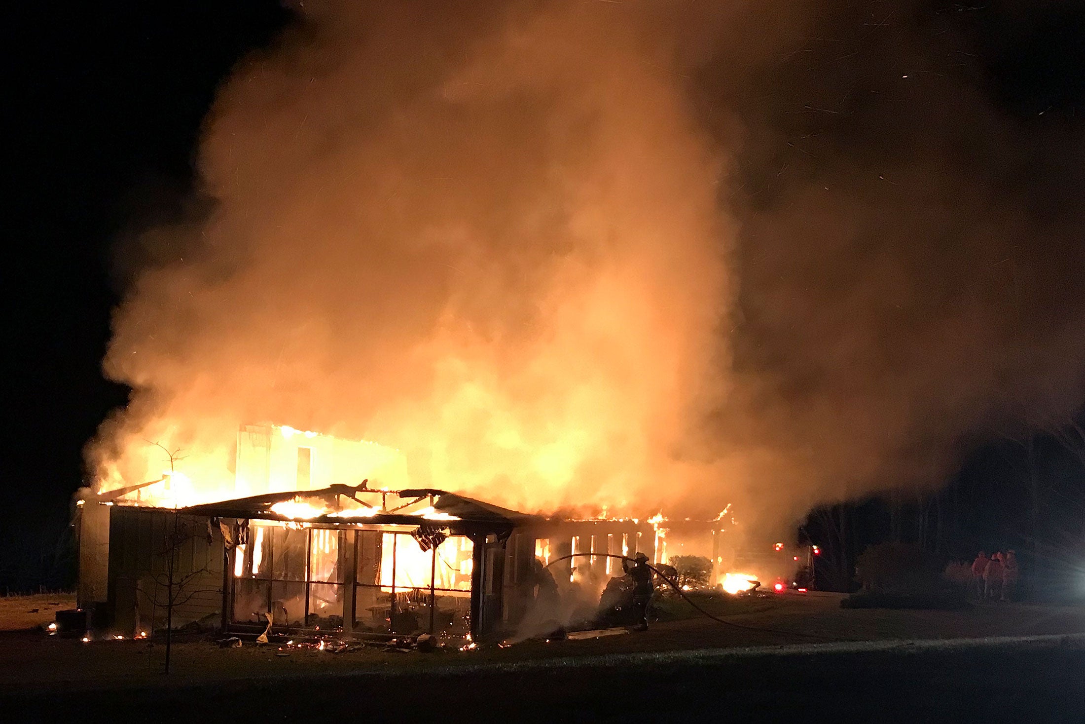 Late at night, fire consuming the structure of the Highlander Education and Research Center in New Market, Tennessee
