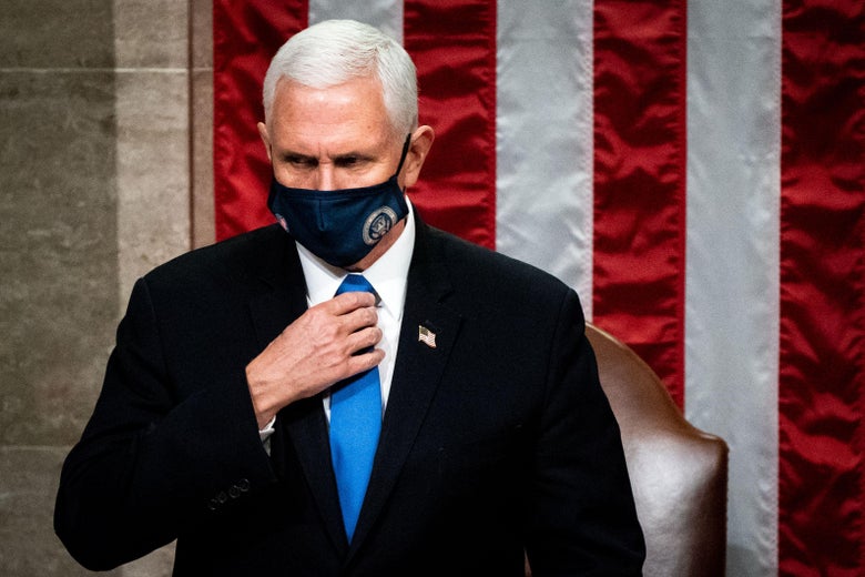 Mike Pence wears a mask and adjusts his tie as he presides over a joint session of Congress on January 6