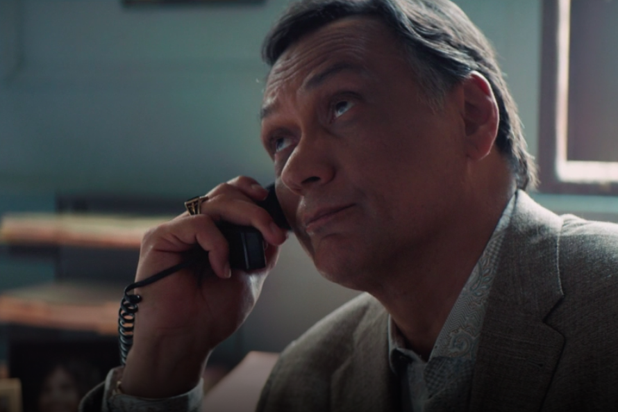 Jimmy Smits, on hold, looking bored