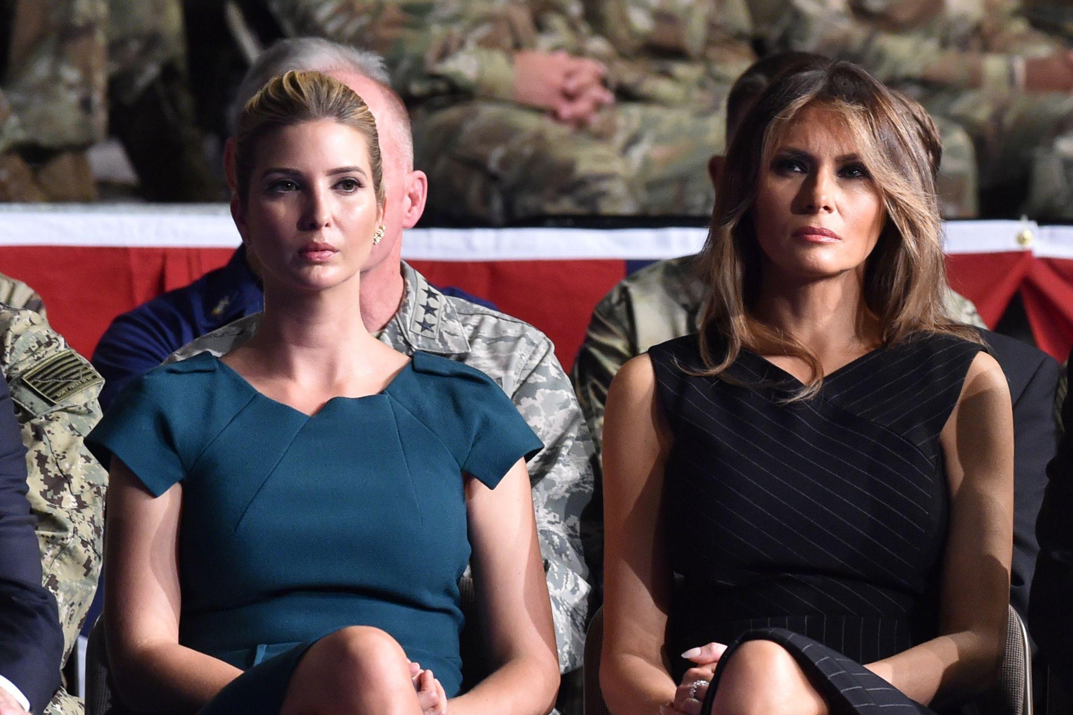 Ivanka Trump and Melania Trump seated side by side.