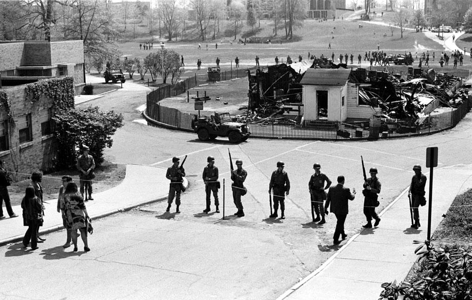 Guardsmen surround the charred remains of the Army ROTC building, May 4, 1970.