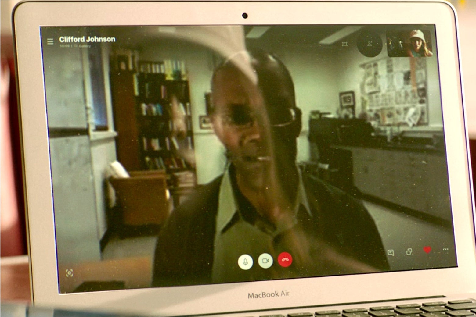 Johnson appears on a MacBook Air via FaceTime, which labels him as “Clifford Johnson”
