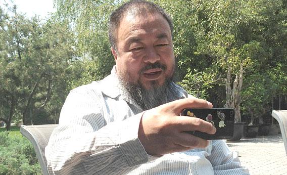 Ai Weiwei taking an iPhone photo.