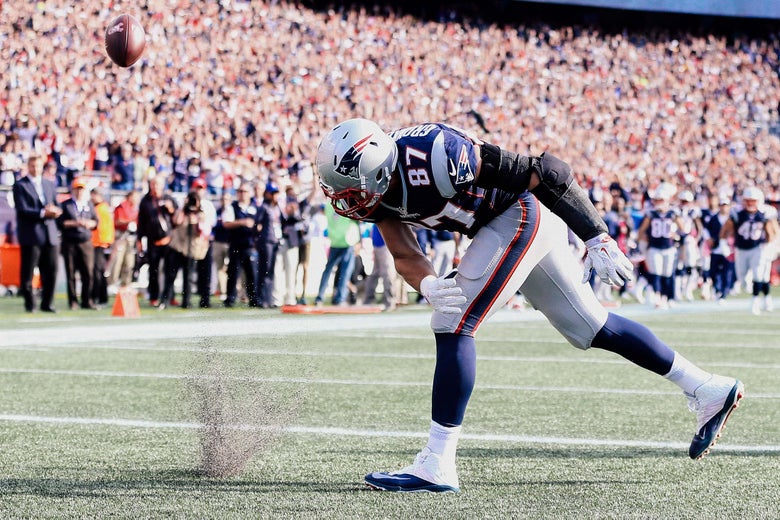 Rob Gronkowski spiking a football.