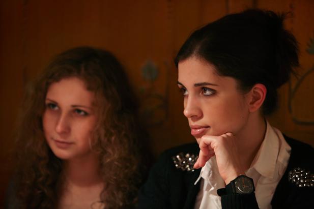 Pussy Riot's Nadezhda Tolokonnikova (R) and Mariya Alekhina in a cafe in downtown Moscow, January 3, 2014. 
