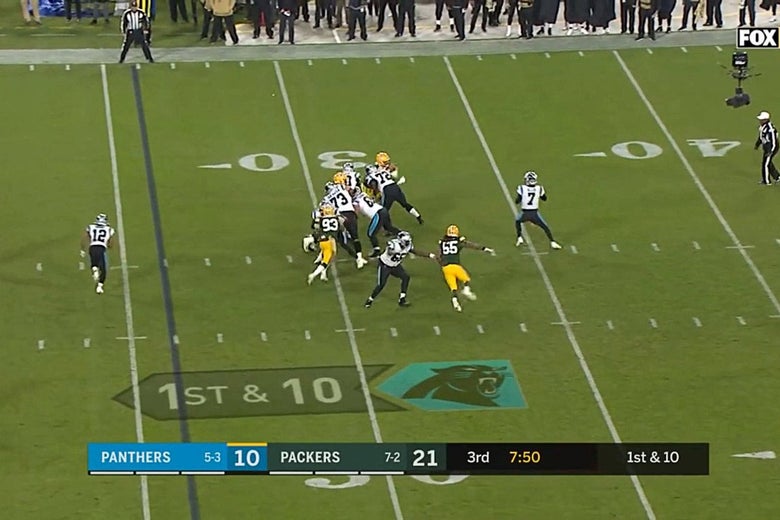 Televised football with giant arrow shown on the field