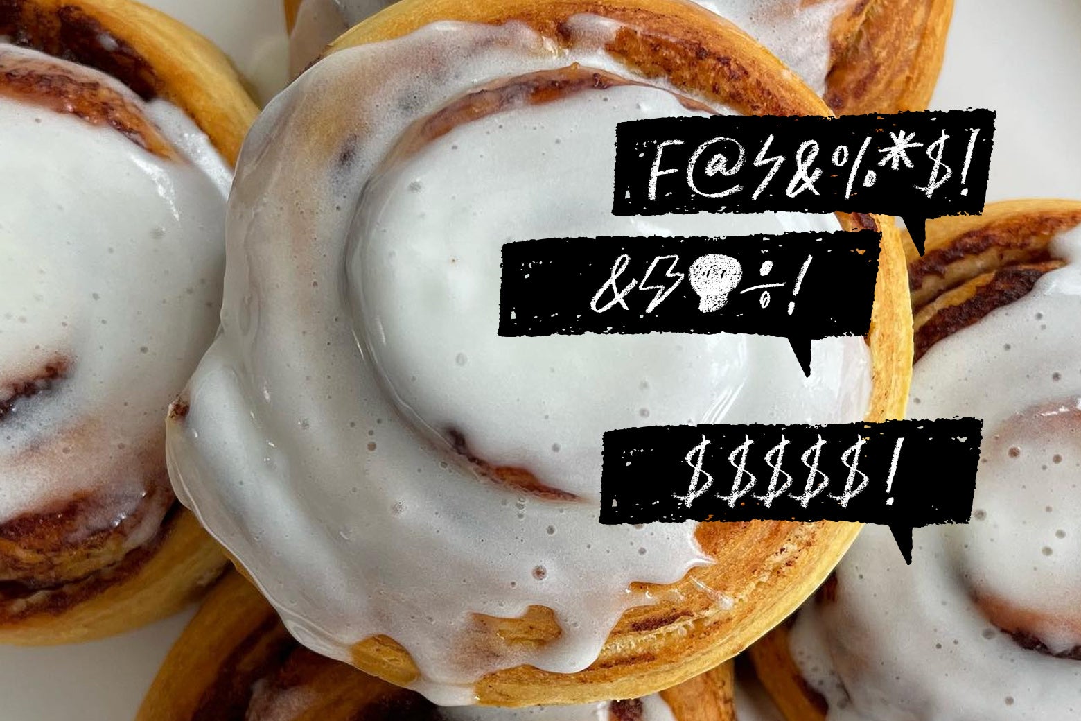 A cinnamon roll has redacted swears over it. 