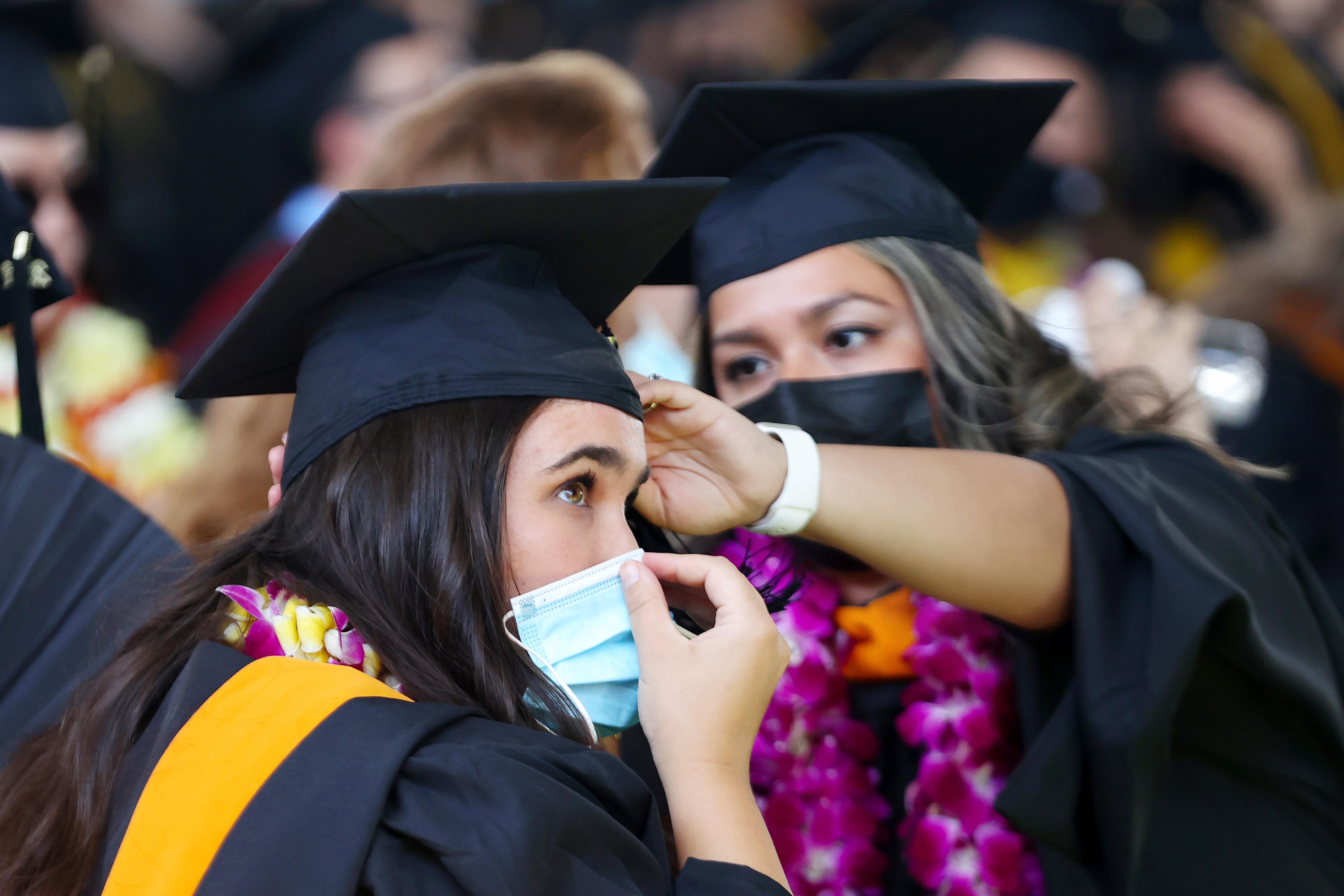 Cal State Los Angeles graduates prepare for their commencement ceremony which was held outdoors beneath a tent on campus on July 27, 2021 in Los Angeles, California. 