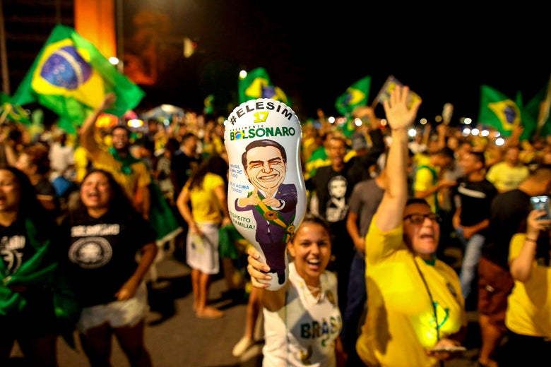 Supporters of Brazilian President-elect Jair Bolsonaro celebrate in front of the National Congress in Brasilia on Sunday.