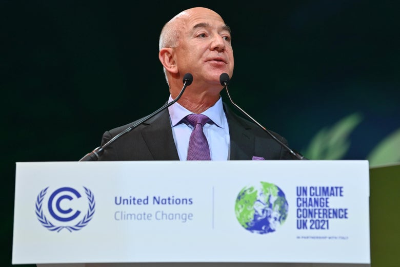 Jeff Bezos speaks at a lectern branded with the United Nations Climate Conference logos.