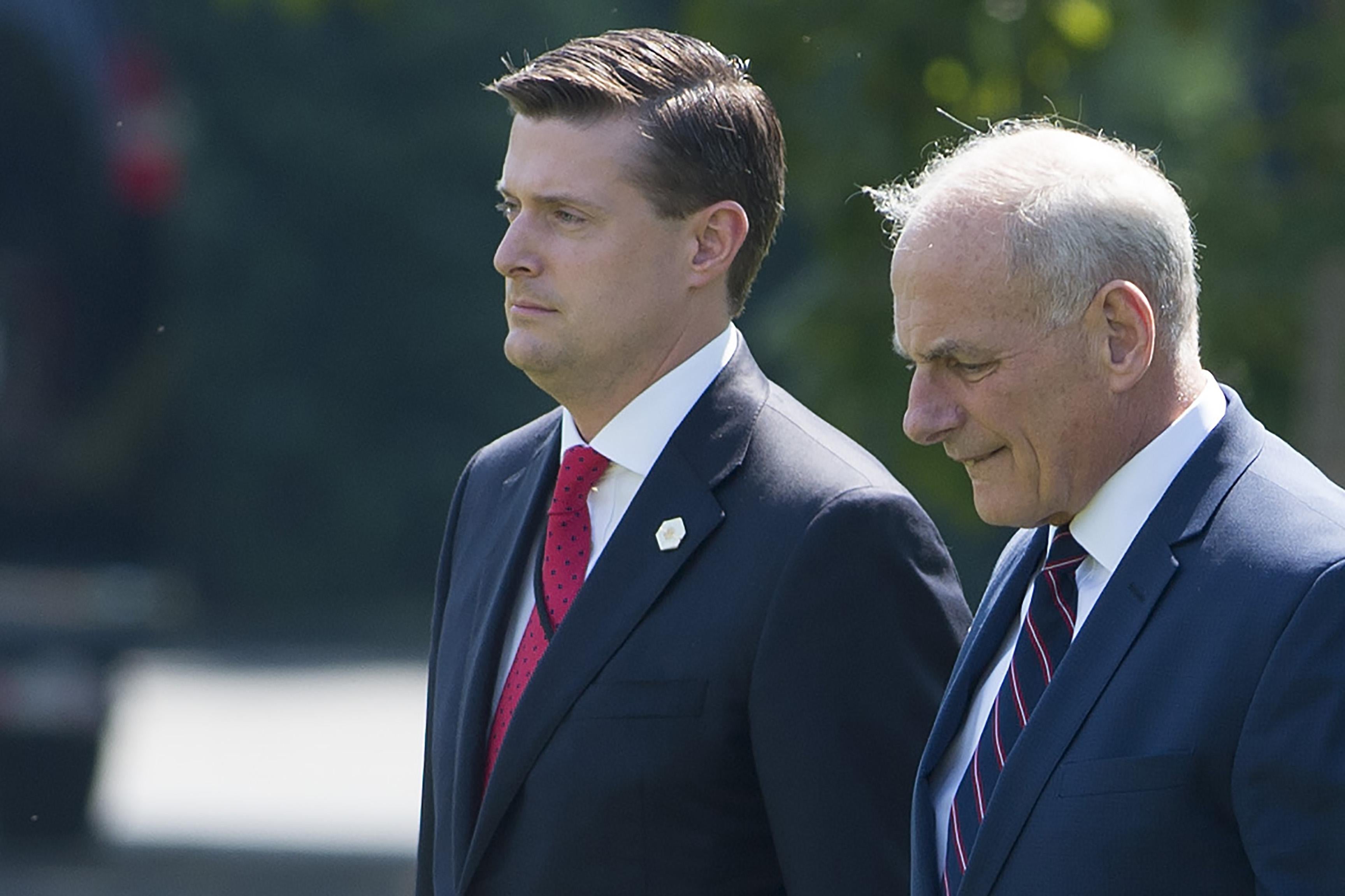 White House Chief of Staff John Kelly (R) and Former White House Staff Secretary Rob Porter (L) outside the White House on August 4, 2017.