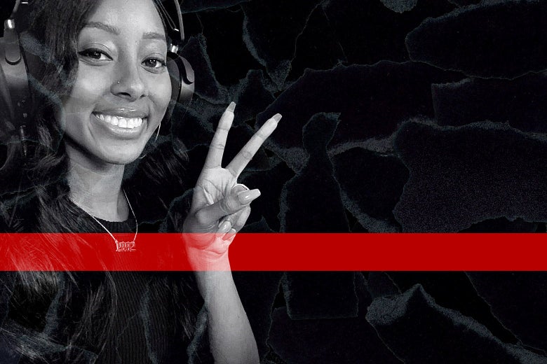 Briana Williams makes a peace sign with her fingers.