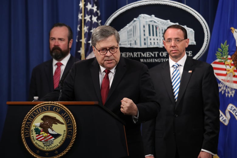 U.S. Attorney General William Barr talks about the Mueller report on Thursday, flanked by U.S. Deputy Attorney General Rod Rosenstein (R) and a man with a glorious beard (L).