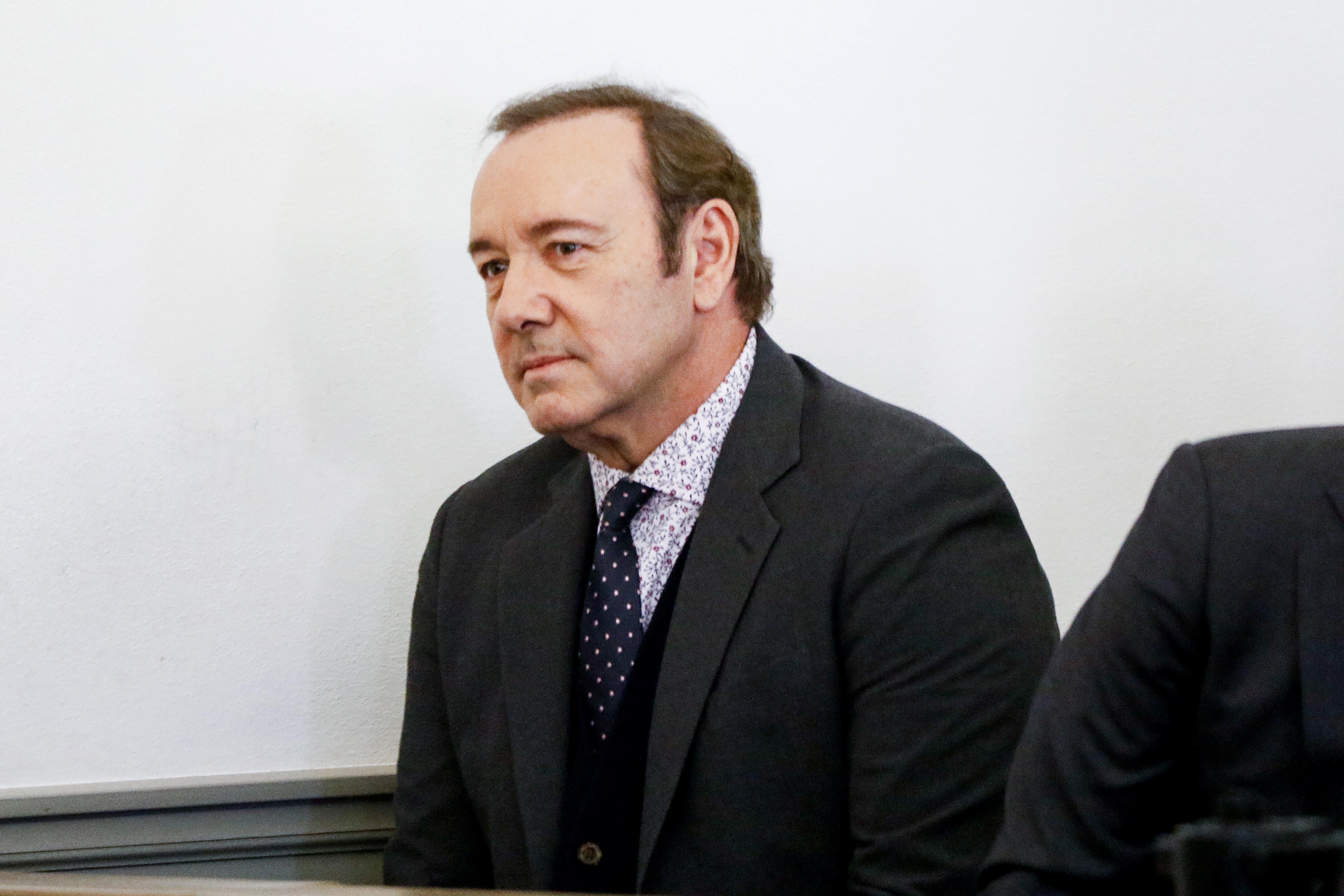 Kevin Spacey sits in a courtroom.