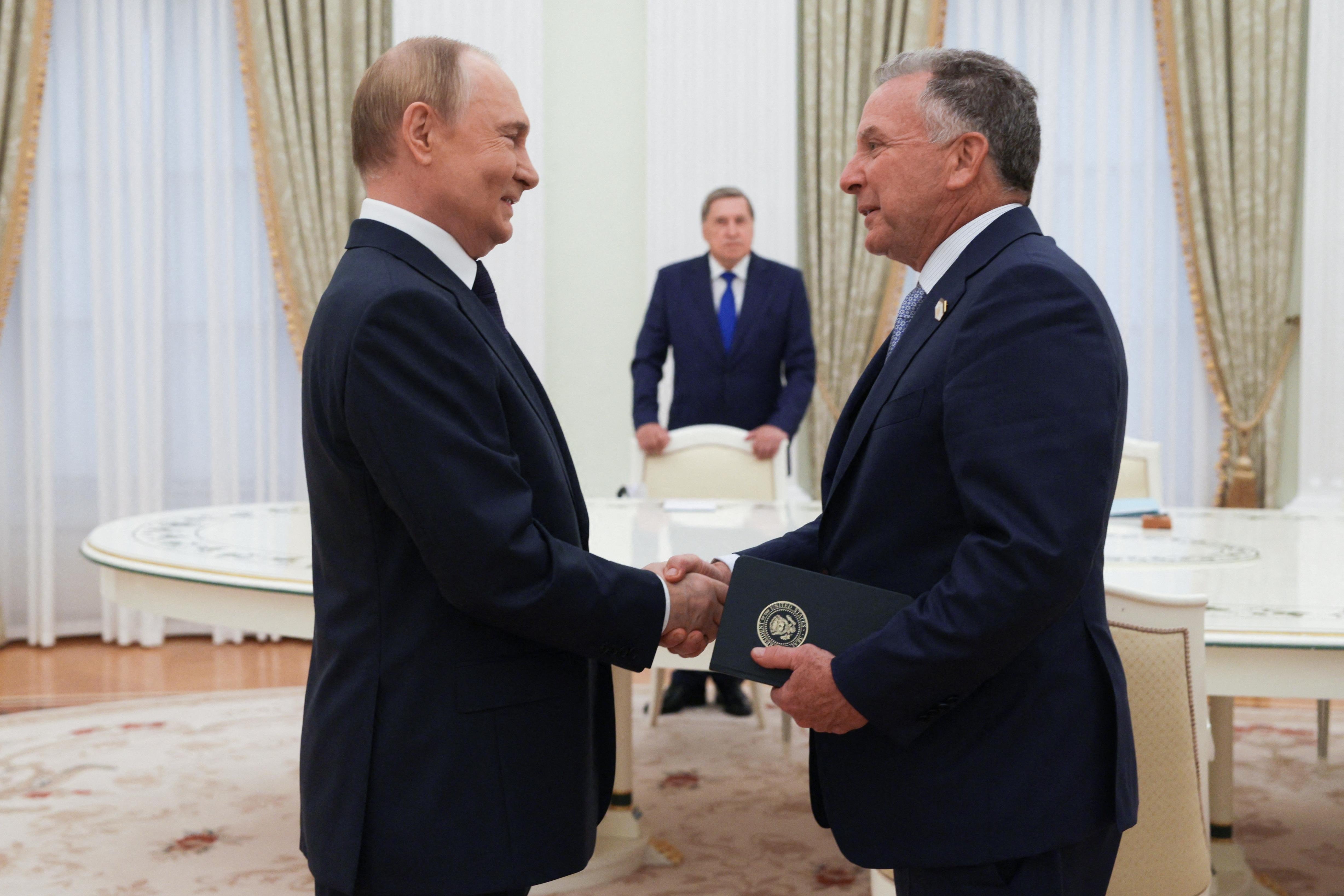     Vladimir Putin and Steve Witkoff shake hands in Moscow. 
