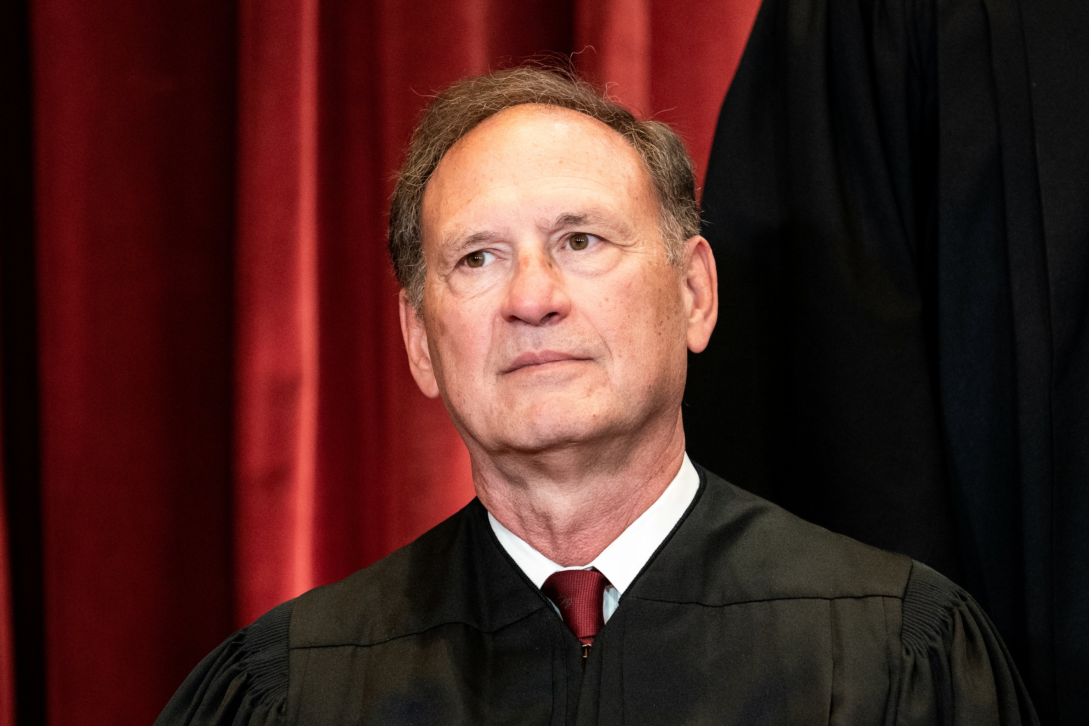 Associate Justice Samuel Alito poses during a group photo of the Justices at the Supreme Court. 