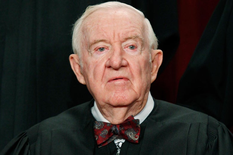 John Paul Stevens poses for a photo in his robes.