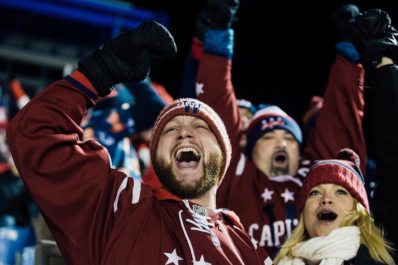 Washington Capitals fans celebrate a goal in the second period during the Coors Light NHL Stadium Series game against the Toronto Maple Leafs at United States Naval Academy on March 3, 2018 in Annapolis, Maryland.