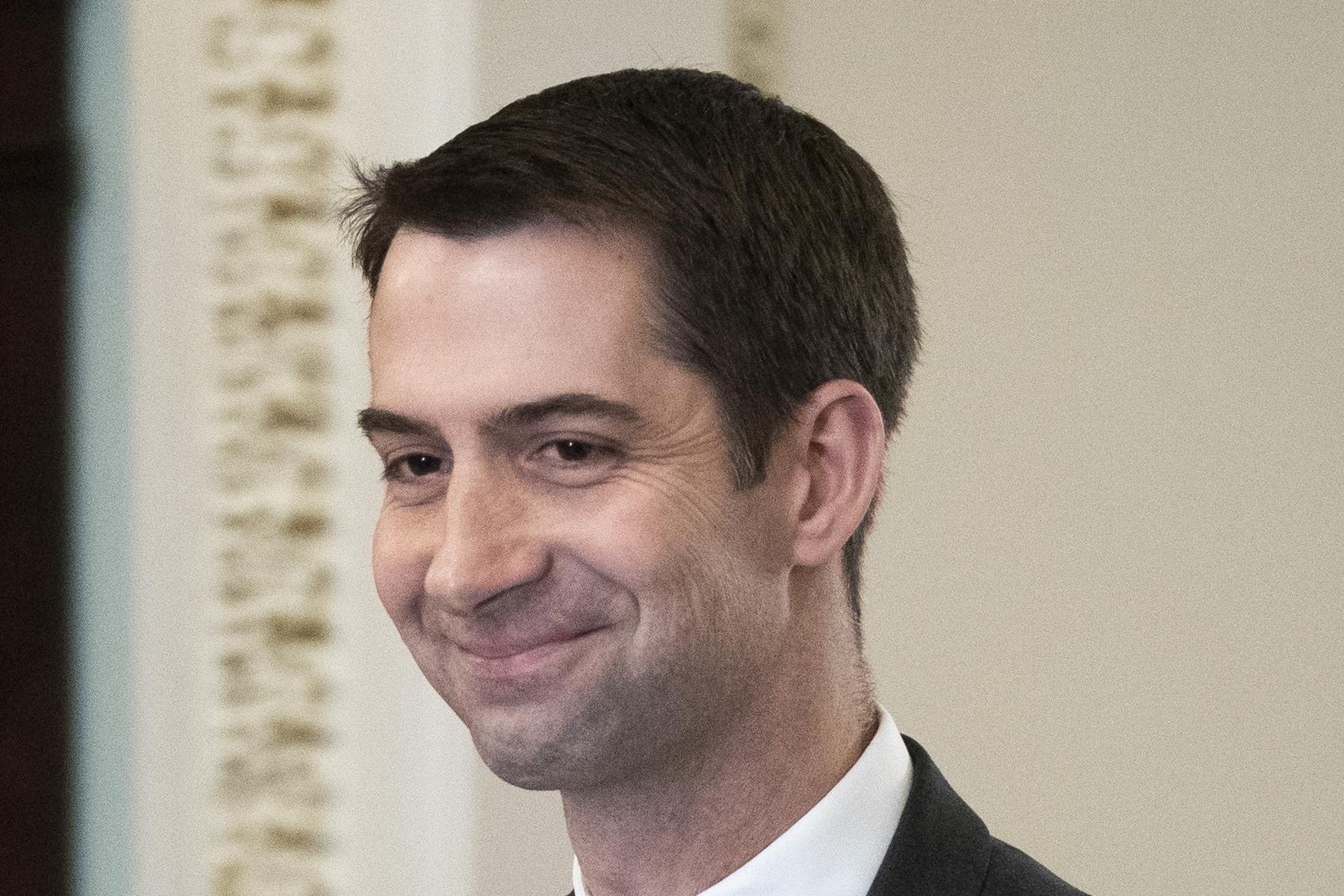 Sen. Tom Cottons smiles as he walks to the Senate floor