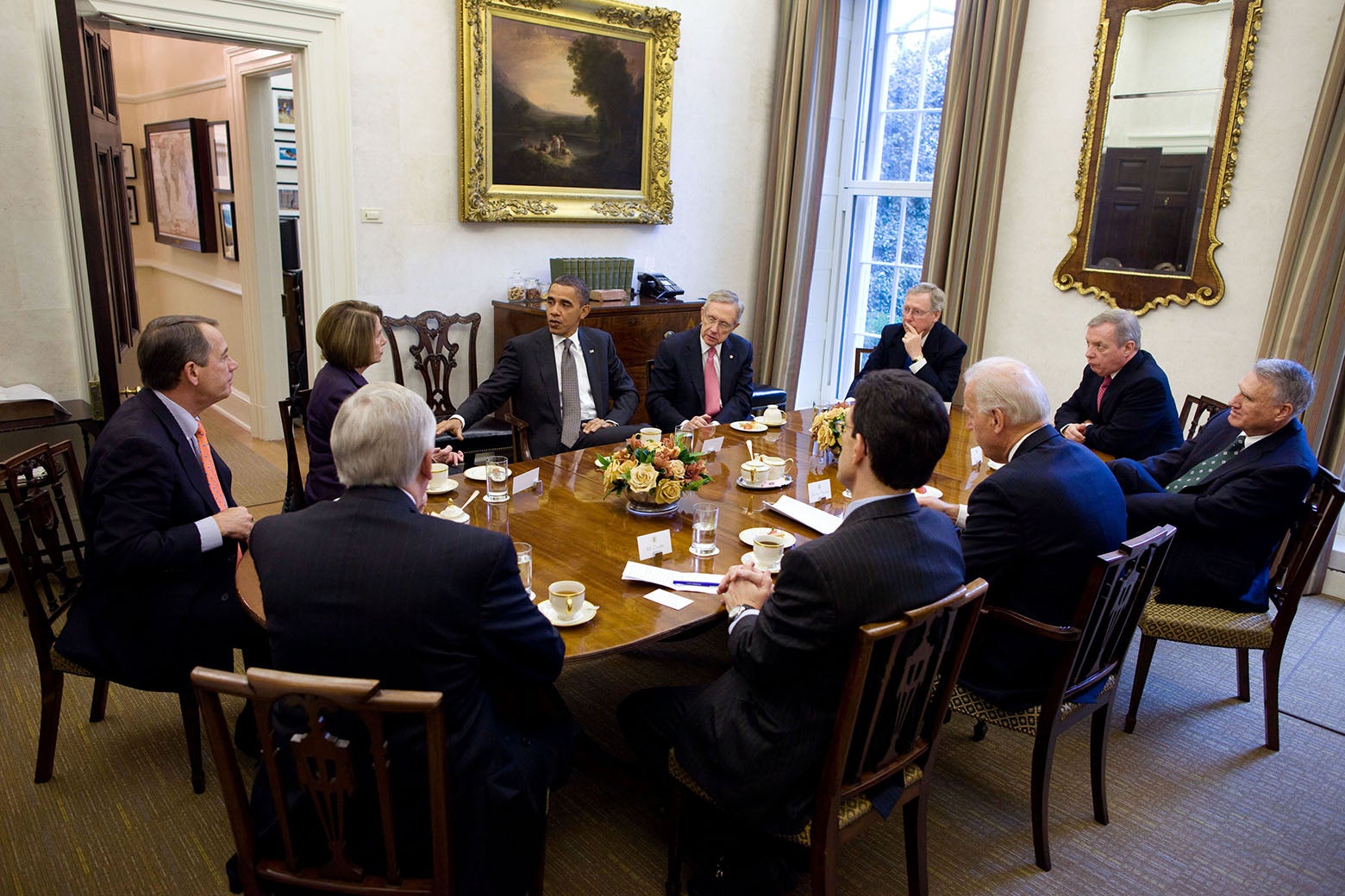 Obama meets with officials in the Presidential Dining Room.