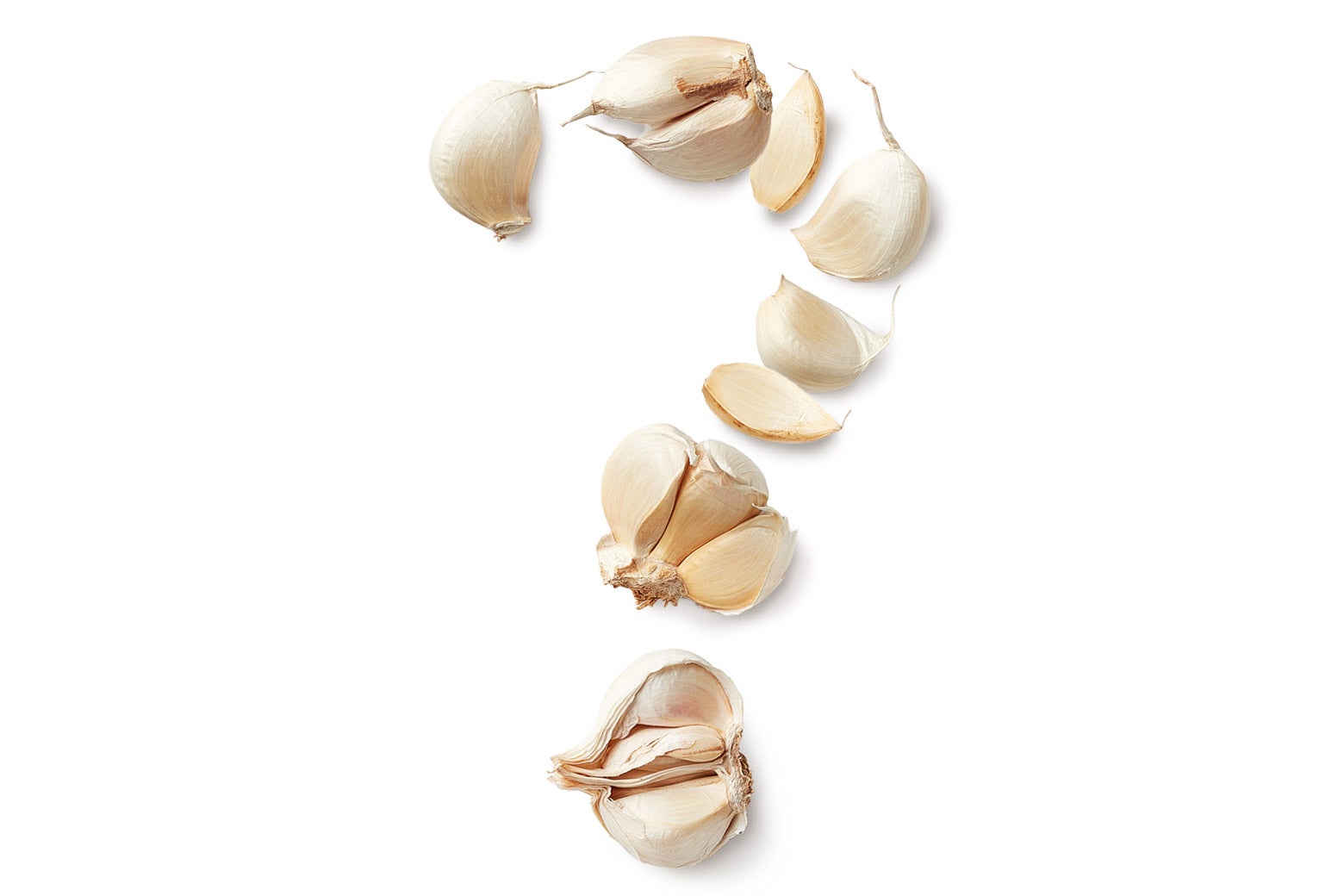 Garlic cloves arranged to form a question mark.