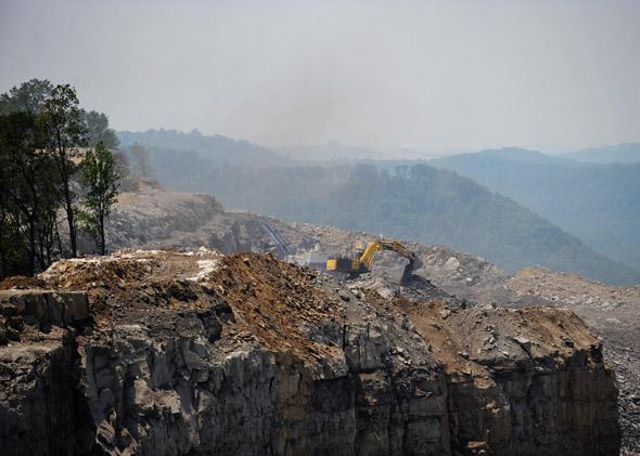 A June 12, 2008 photo shows heavy machinery working at a coal mine on top of Kayford Mountain in West Virginia. 