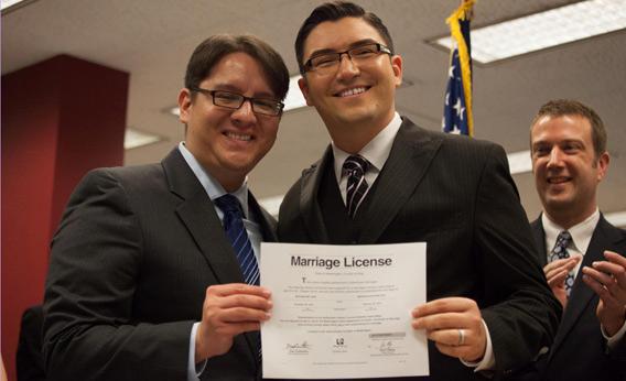 Brendon K. Taga (L) and Jesse Pageat, the second couple to receive a same-sex marriage license in Washington state.