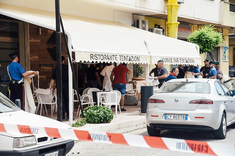 Police and caution tape outside an restaurant in Italy.