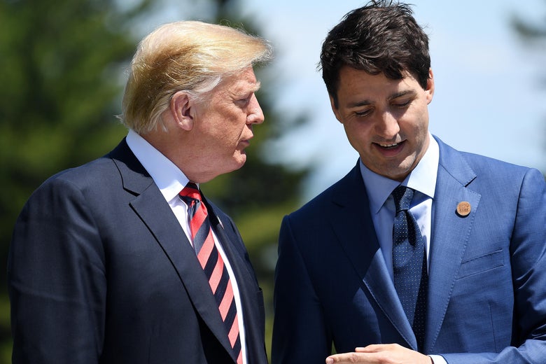 Prime Minister of Canada Justin Trudeau speaks with President Donald Trump during the G-7 official welcome at Le Manoir Richelieu on June 8, 2018 in Quebec City, Canada.