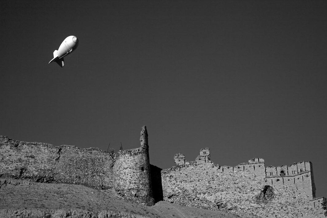 An aerostat balloon carrying out security surveillance floats over the 5th Century fortress Bala Hissar in Kabul. Afghanistan on December 2. 2012.