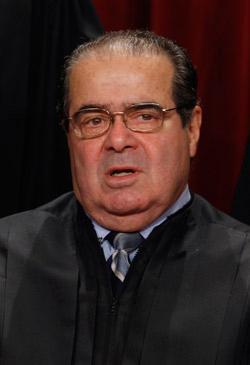 U.S. Supreme Court Associate Justice Antonin Scalia poses for photographs.