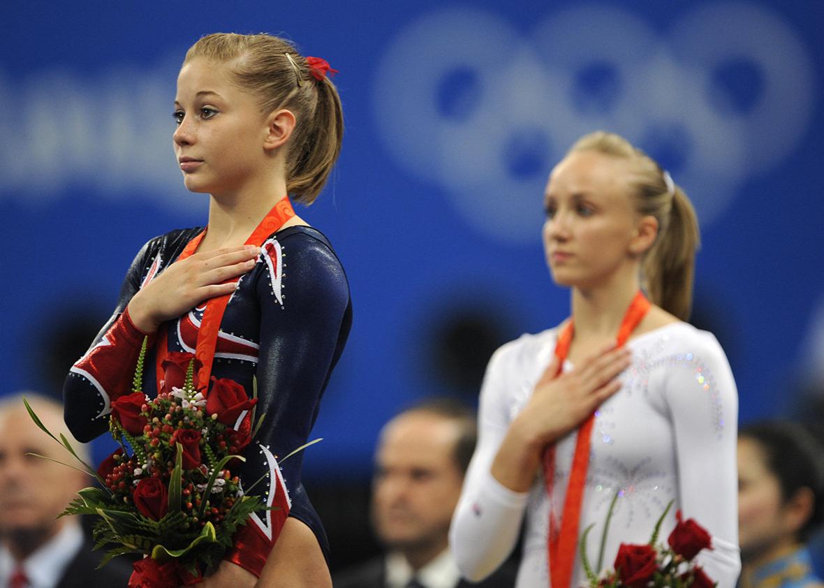 United States' Shawn Johnson and her compatriot United States' Nastia Liukin stand on the podium after the women's balance beam final of the artistic gymnastics event of the Beijing 2008 Olympic Games in Beijing on August 19, 2008.  
